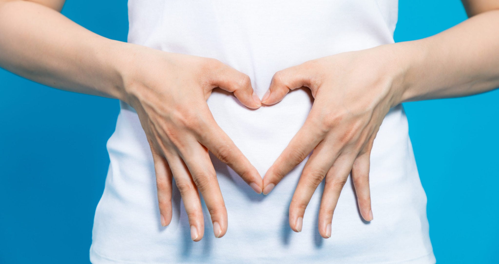 A person making a heart with their hands
